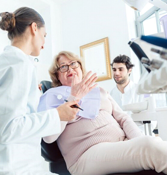 patient talking with dental team during consultation