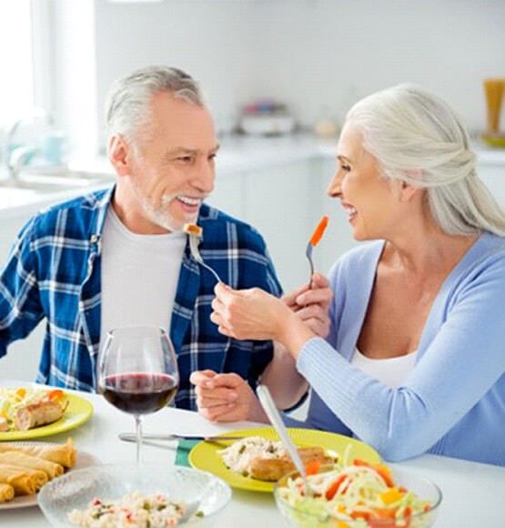 older couple enjoying a romantic meal