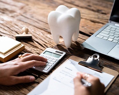 A patient checking their dental insurance for wisdom tooth coverage