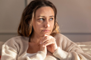 Woman lost in thought about her missing wisdom teeth